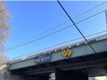 A "Welcome to High Bridge" sign sitting on the NJT trestle over Bridge St in High Bridge